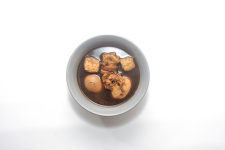 Eggs boiled stewed in the gravy on white backgroundの写真素材