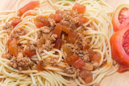 close up of spaghetti with sauce and forkの写真素材
