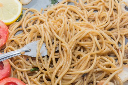 close up of spaghetti seafood with forkの写真素材