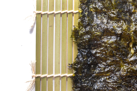 close up of seaweed sheet on white backgroundの写真素材