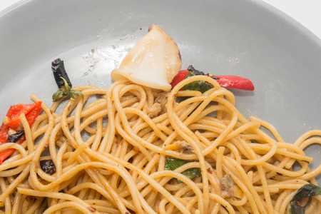 spaghetti with seafood on plate isolated on white backgroundの写真素材