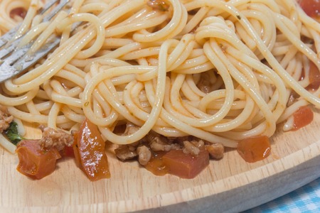 close up of spaghetti with sauce and forkの写真素材