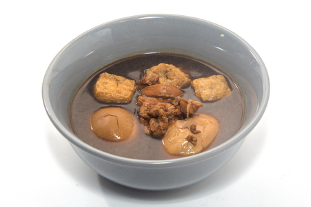 Eggs boiled stewed in the gravy on white backgroundの写真素材