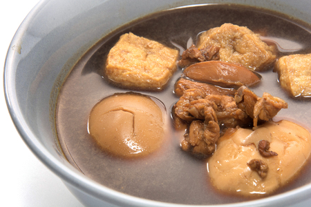 Eggs boiled stewed in the gravy on white backgroundの写真素材