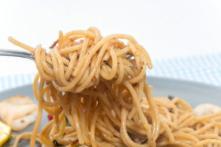 close up of spaghetti seafood with forkの写真素材