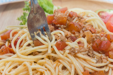 close up of spaghetti with sauce and forkの写真素材