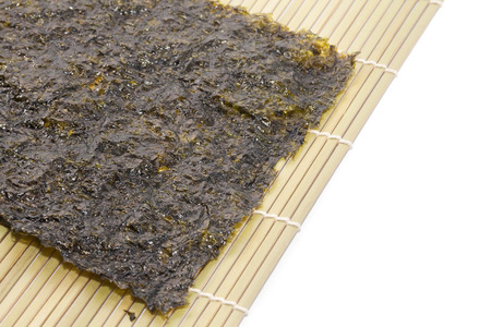 close up of seaweed sheet on white backgroundの写真素材