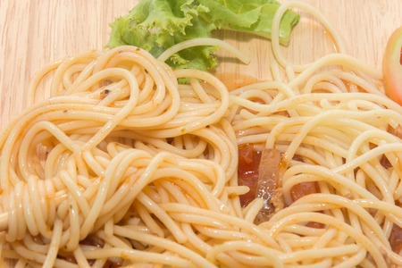 close up of spaghetti with sauce and chopstickの写真素材