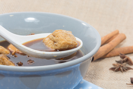 Eggs boiled stewed in the gravy on white backgroundの写真素材