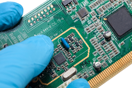 blue glove and Print Circuit Board of graphic cardの写真素材