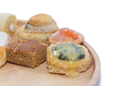 a variety of bakery on wooden plateの写真素材