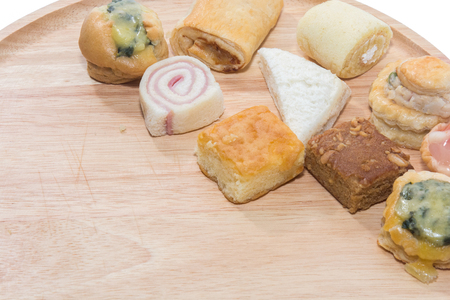 a variety of bakery on wooden plateの写真素材