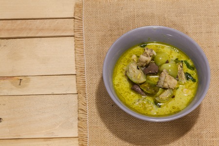 Green Curry With Chicken on grey bowlの写真素材