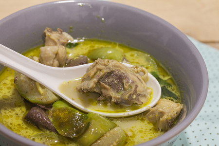 Green Curry With Chicken on grey bowlの写真素材