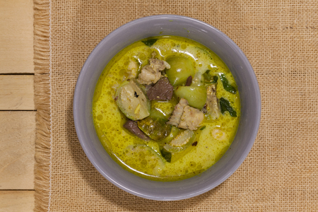 Green Curry With Chicken on grey bowlの写真素材