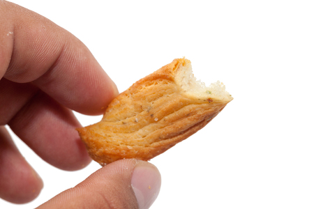hand holding bread stick isolated on white backgroundの写真素材