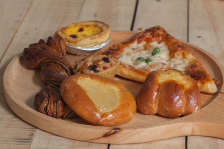 close up of variety of bakery on wooden plateの写真素材