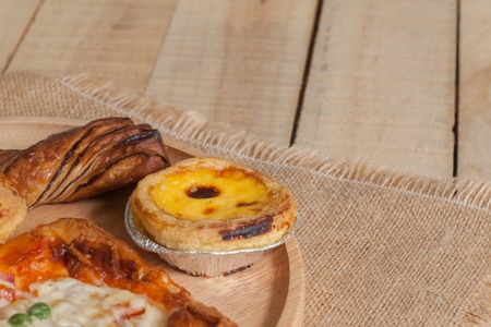 close up of variety of bakery on wooden plateの写真素材