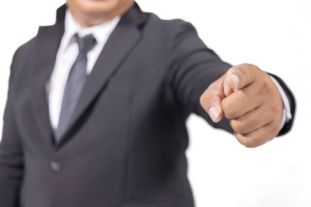 businessman in a suit pointing with his fingerの写真素材