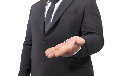 businessman in a suit opening palm hands on white backgroundの写真素材