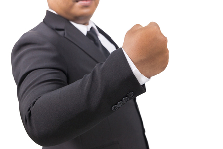 businessman in a suit hand fist, winner concept on white backgroundの写真素材