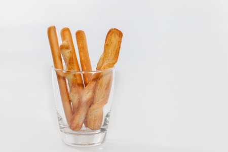 bread stick on cup isolated on white backgroundの写真素材