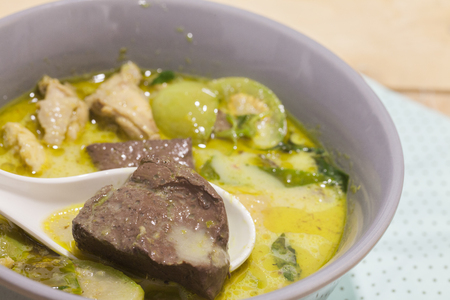 Green Curry With Chicken on grey bowlの写真素材