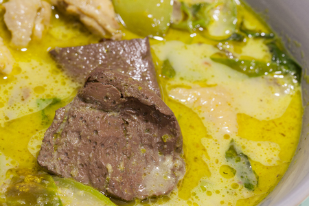 Green Curry With Chicken on grey bowlの写真素材