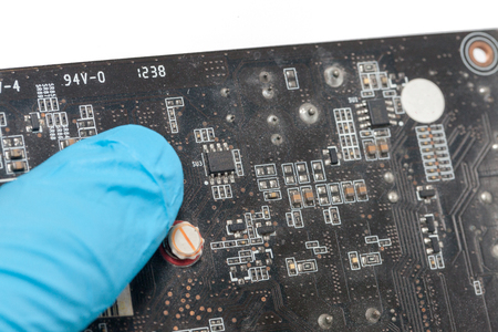 blue glove and Print Circuit Board of graphic cardの写真素材