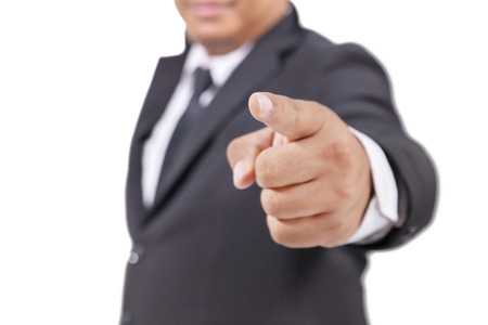businessman in a suit pointing with his fingerの写真素材