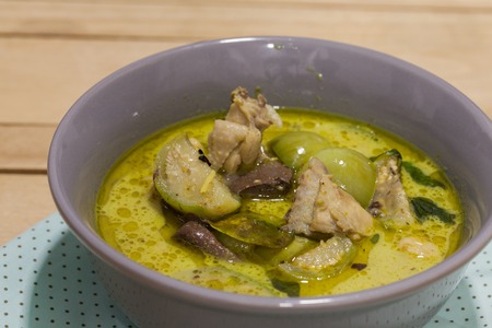 Green Curry With Chicken on grey bowlの写真素材