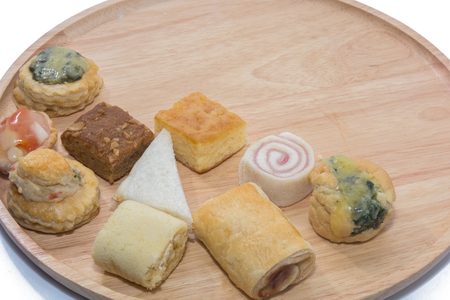 a variety of bakery on wooden plateの写真素材