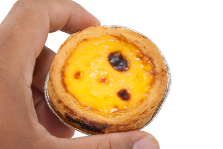 close up of hand holding egg tartの写真素材