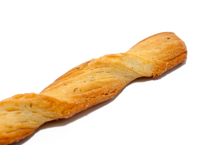 twisted bread stick isolated on white backgroundの写真素材
