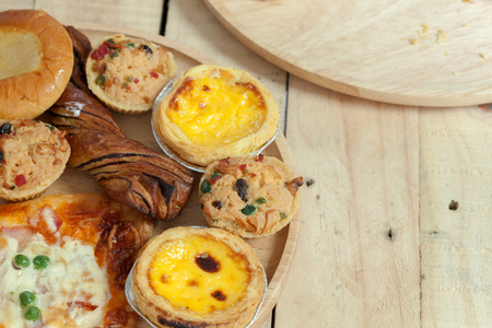 close up of variety of bakery on wooden plateの写真素材