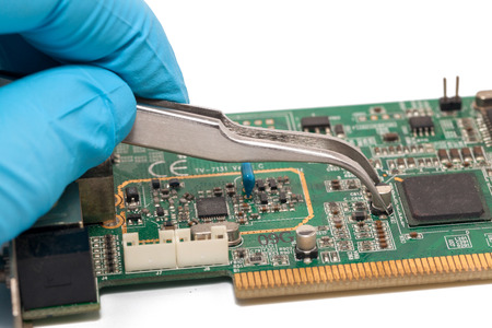 blue glove and Print Circuit Board of graphic cardの写真素材