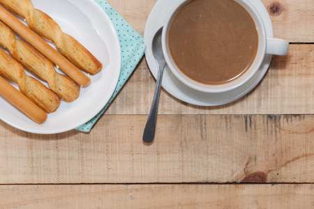 salted bread stick and cup of coffeeの写真素材