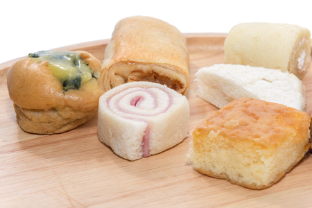 a variety of bakery on wooden plateの写真素材