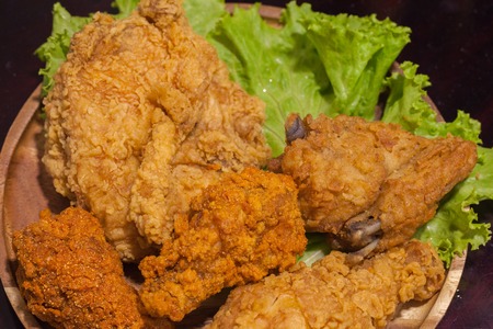close up of fried chickens on wooden plateの写真素材