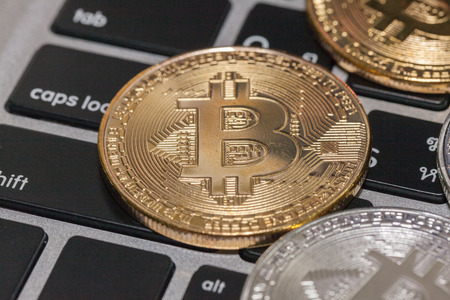close up of bitcoin on the keyboardの写真素材