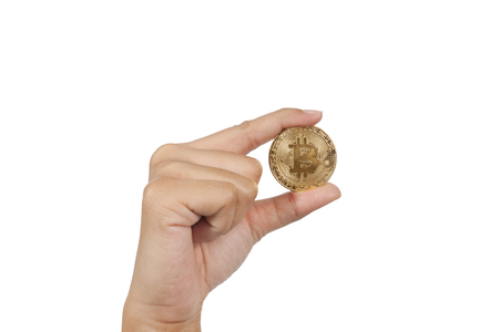 close up of hand holding bitcoin on white backgroundの写真素材