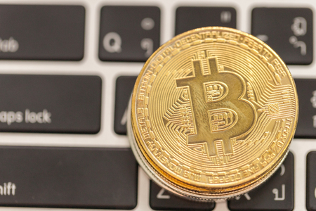 close up of bitcoin on the keyboardの写真素材