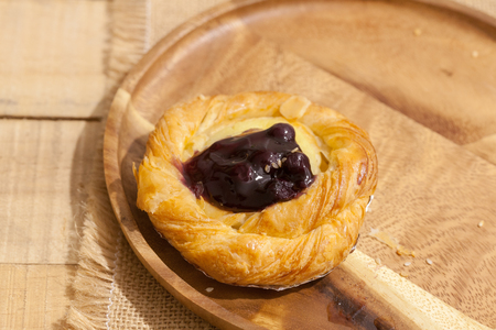 a variety of bakery on wooden plateの写真素材