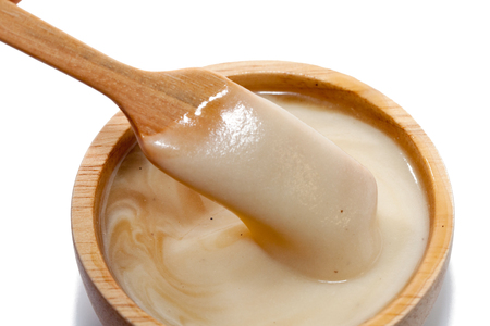 close up of mash potato on wooden bowlの写真素材