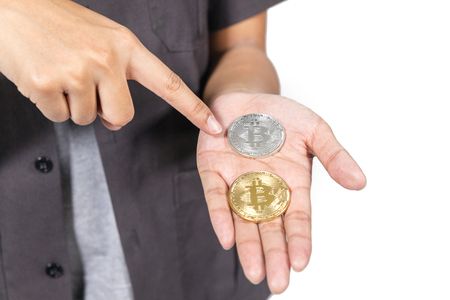 close up of hand holding bitcoin on white backgroundの写真素材