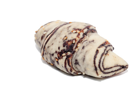 close up of black white croissant on white backgroundの写真素材