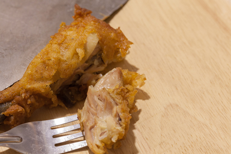 close up of fried chickens on black plateの写真素材