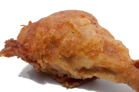 close up of fried chicken isolated on white backgroundの写真素材