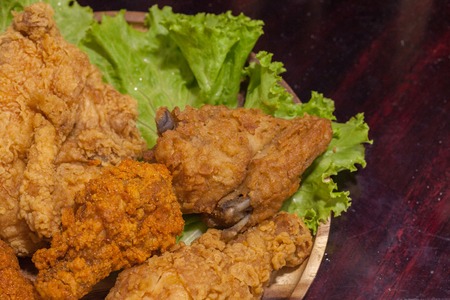 close up of fried chickens on wooden plateの写真素材