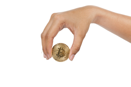 close up of hand holding bitcoin on white backgroundの写真素材